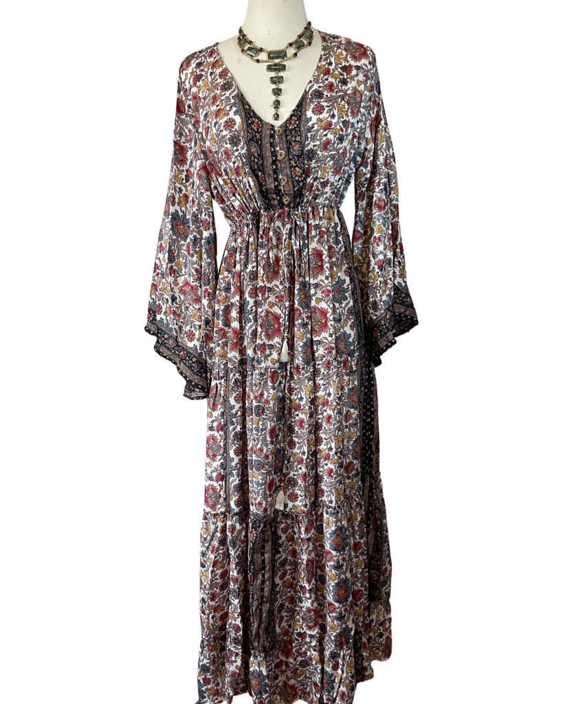 https://www.vicicollection.com/products/maxi-dress-with-bell-sleeves Honey Shadow Tiered Bell Sleeve Maxi Dress VICI