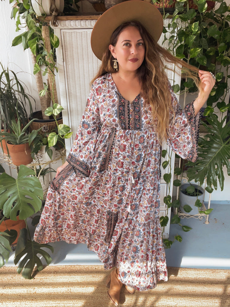 https://www.vicicollection.com/products/maxi-dress-with-bell-sleeves Bloom Belle Tiered Floral Maxi Dress VICI