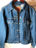 Denim jacket with added hand beaded cow skull on African Mud cloth